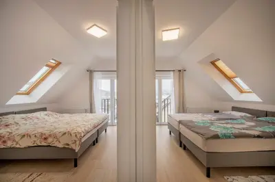 Łóżko lub łóżka w pokoju w obiekcie Dom z Widokiem na Góry i Jacuzzi - 
