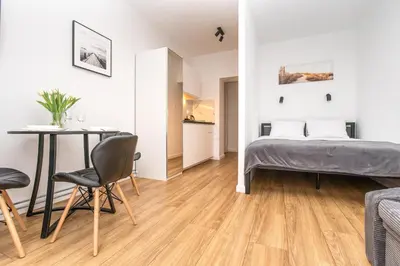 Łóżko lub łóżka w pokoju w obiekcie Apartamenty Piastowska