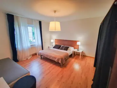 Łóżko lub łóżka w pokoju w obiekcie Apartamenty Bystrzycka 63