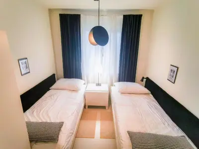 Łóżko lub łóżka w pokoju w obiekcie Apartamenty Bystrzycka 63