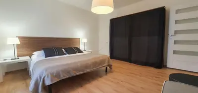 Łóżko lub łóżka w pokoju w obiekcie Apartamenty Bystrzycka 63