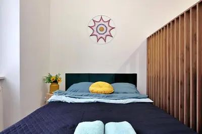 Łóżko lub łóżka w pokoju w obiekcie Apartamenty Matejki