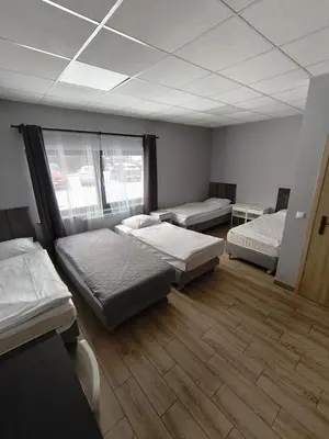 Łóżko lub łóżka w pokoju w obiekcie Ząbkowickie Centrum Sportu i Rekreacji Sp. z o. o.