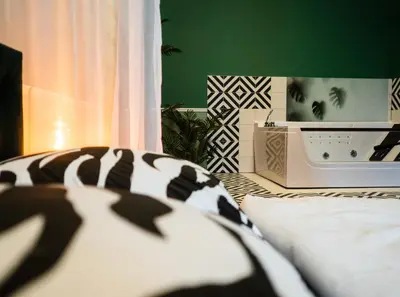 Łóżko lub łóżka w pokoju w obiekcie Punkt - Apartament z jacuzzi w centrum Gliwic