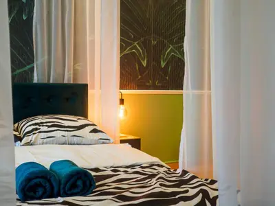 Łóżko lub łóżka w pokoju w obiekcie Punkt - Apartament z jacuzzi w centrum Gliwic