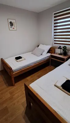 Łóżko lub łóżka w pokoju w obiekcie Noclegi u Lidki