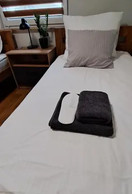Łóżko lub łóżka w pokoju w obiekcie Noclegi u Lidki