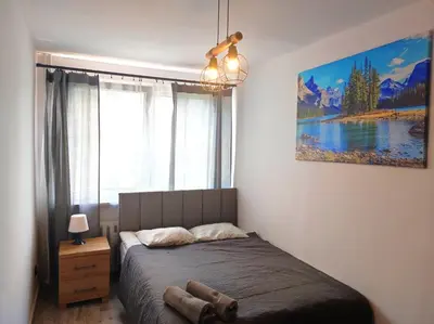Łóżko lub łóżka w pokoju w obiekcie Apartments 4 You