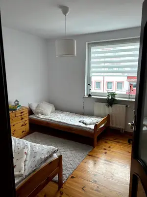 Łóżko lub łóżka w pokoju w obiekcie Apartament Kozia