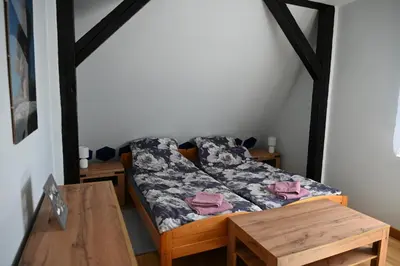 Łóżko lub łóżka w pokoju w obiekcie Strażnica Pod Lasem