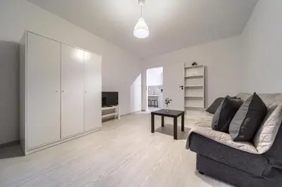 Telewizja i/lub zestaw kina domowego w obiekcie Madalińskiego Comfort Apartment by BookingHost