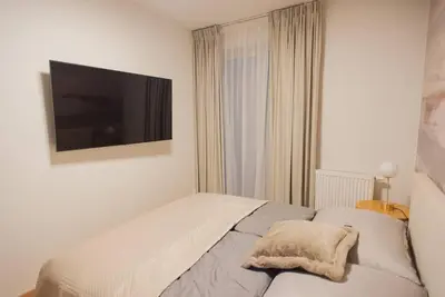 Łóżko lub łóżka w pokoju w obiekcie Gliwice Dickensa 36A Condo
