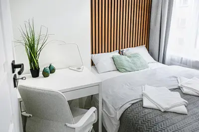 Łóżko lub łóżka w pokoju w obiekcie Wyjątkowe apartamenty w Centrum