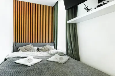 Łóżko lub łóżka w pokoju w obiekcie Wyjątkowe apartamenty w Centrum