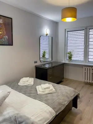 Łóżko lub łóżka w pokoju w obiekcie Apartament Iga