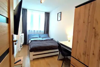 Łóżko lub łóżka w pokoju w obiekcie Apartament Górski Widok