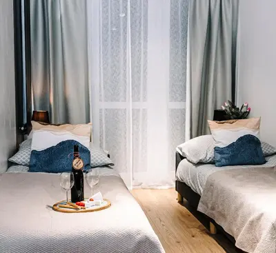 Łóżko lub łóżka w pokoju w obiekcie Apartament Hutnicza