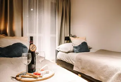 Łóżko lub łóżka w pokoju w obiekcie Apartament Hutnicza