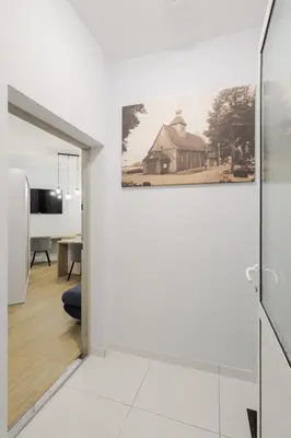 Łóżko lub łóżka w pokoju w obiekcie Apartamenty Różane