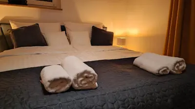 Łóżko lub łóżka w pokoju w obiekcie Apartament na Poli