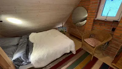 Łóżko lub łóżka w pokoju w obiekcie Domek za lipą