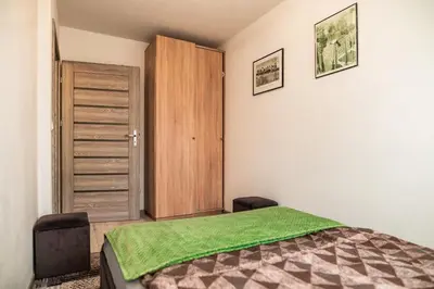 Łóżko lub łóżka w pokoju w obiekcie Apartament 45m2