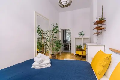 Łóżko lub łóżka w pokoju w obiekcie Plac Grunwaldzki Cosy Apartment by BookingHost