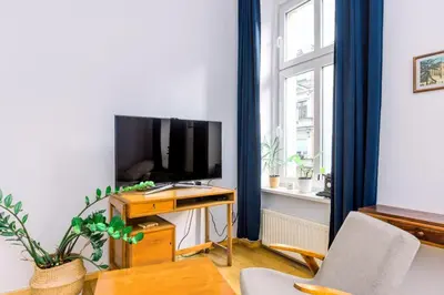Telewizja i/lub zestaw kina domowego w obiekcie Plac Grunwaldzki Cosy Apartment by BookingHost
