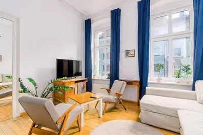 Telewizja i/lub zestaw kina domowego w obiekcie Plac Grunwaldzki Cosy Apartment by BookingHost