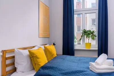 Łóżko lub łóżka w pokoju w obiekcie Plac Grunwaldzki Cosy Apartment by BookingHost