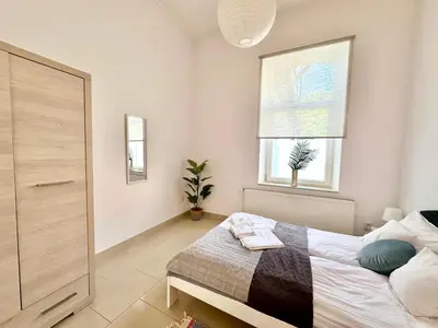 Łóżko lub łóżka w pokoju w obiekcie Komfortowy apartament z tarasem w pobliżu jeziora i Gór Sowich