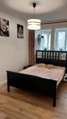 Łóżko lub łóżka w pokoju w obiekcie Apartament Iwona