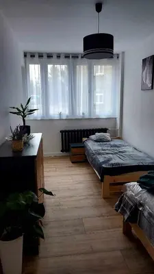 Łóżko lub łóżka w pokoju w obiekcie Apartament Iwona