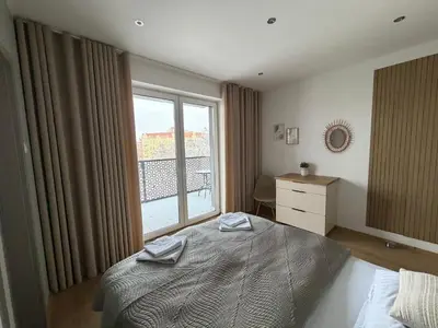 Łóżko lub łóżka w pokoju w obiekcie Przestronny 3 pokojowy apartament Park City