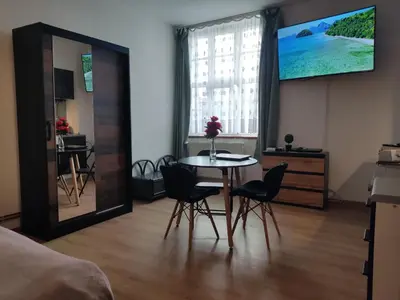 Telewizja i/lub zestaw kina domowego w obiekcie Mini Apartament Studio