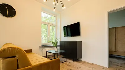 Telewizja i/lub zestaw kina domowego w obiekcie VacationClub - Old Town Apartament 8B