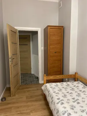 Łóżko lub łóżka w pokoju w obiekcie Apartament na Przedmieściu by Apartamenty na dni Wrocław