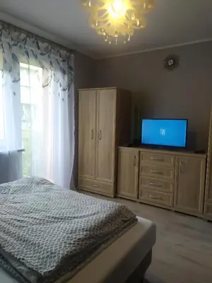Łóżko lub łóżka w pokoju w obiekcie Studio Niebieskie
