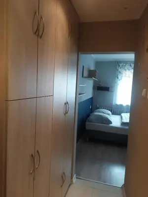 Łóżko lub łóżka w pokoju w obiekcie Studio Niebieskie