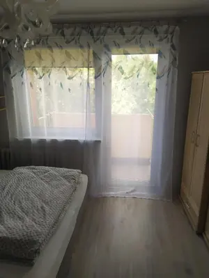 Łóżko lub łóżka w pokoju w obiekcie Studio Niebieskie
