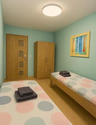 Łóżko lub łóżka w pokoju w obiekcie TK Apartments Dąbrowskiego