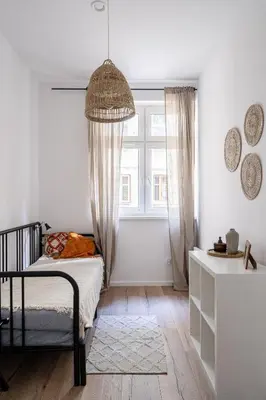 Łóżko lub łóżka w pokoju w obiekcie RentPlanet - Apartament Cybulskiego