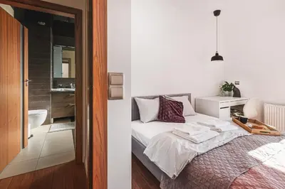 Łóżko lub łóżka w pokoju w obiekcie Apartament z Jacuzzi Parking Balkon 2 sypialnie