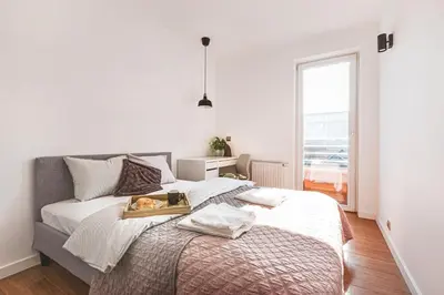Łóżko lub łóżka w pokoju w obiekcie Apartament z Jacuzzi Parking Balkon 2 sypialnie