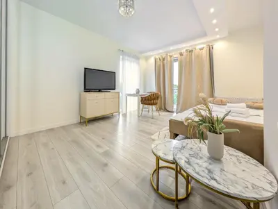 Łóżko lub łóżka w pokoju w obiekcie Kościańska Cosy Apartment by BookingHost