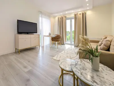 Telewizja i/lub zestaw kina domowego w obiekcie Kościańska Cosy Apartment by BookingHost