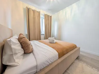 Łóżko lub łóżka w pokoju w obiekcie Kościańska Cosy Apartment by BookingHost