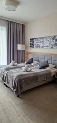 Łóżko lub łóżka w pokoju w obiekcie Apartament Czarna Góra MOON