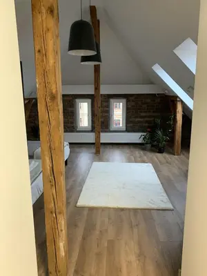 Łóżko lub łóżka w pokoju w obiekcie Apartamenty Astor - Księżycowy