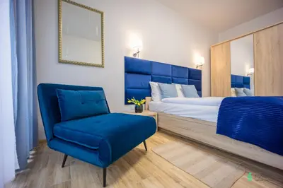 Łóżko lub łóżka w pokoju w obiekcie Apartament Gambit, Ogrody Pieniawskie, MyWeek